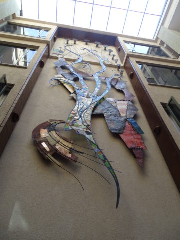 Reaching up Installation: Stain glass, scrap metal Style: Stylised Theme: Rustic African Installation Art Piece by Kenyan Artist.
