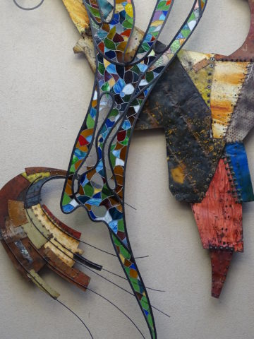 Reaching up Installation: Stained glass, scrap metal Atrium piece, old mabati, the piece invites viewers to interact with the space. Style: Stylised Theme: Rustic African Installation Art Piece by Kenyan Artist.